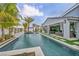 Relaxing backyard pool area with a covered patio and lush tropical landscaping at 4345 N Dapple Gray Rd, Las Vegas, NV 89129