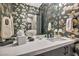 Stylish powder room featuring modern fixtures, unique decor, and wallpaper at 4345 N Dapple Gray Rd, Las Vegas, NV 89129
