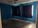 Bedroom featuring blue painted walls, dark curtains, a ceiling fan, and a window with natural light at 4442 Bennett Dr, Las Vegas, NV 89121