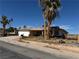 Street view of a single-story home with desert landscaping and a two-car garage at 4442 Bennett Dr, Las Vegas, NV 89121