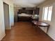 Eat-in kitchen features dark wood cabinets and stainless steel appliances at 4442 Bennett Dr, Las Vegas, NV 89121