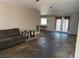 Spacious living room with a large window and glass doors leading outside at 4442 Bennett Dr, Las Vegas, NV 89121