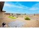 Beautiful backyard with desert landscaping, decorative rock, and a paved patio at 4560 E Cactus Canyon Dr, Pahrump, NV 89061