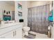 Well-lit bathroom with a neutral color scheme featuring decorative towels, and a tiled floor at 4560 E Cactus Canyon Dr, Pahrump, NV 89061