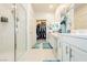 Bathroom with dual sinks, a glass shower, and a walk-in closet for luxurious living at 4560 E Cactus Canyon Dr, Pahrump, NV 89061