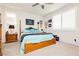 Bedroom with a four-poster bed, neutral carpet, and ample natural light, creating a serene retreat at 4560 E Cactus Canyon Dr, Pahrump, NV 89061