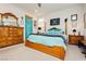 Bright bedroom with a wooden bed frame and soft blue bedding, creating a relaxing and inviting space at 4560 E Cactus Canyon Dr, Pahrump, NV 89061