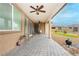 Spacious covered patio with brick flooring, ceiling fans, and outdoor seating at 4560 E Cactus Canyon Dr, Pahrump, NV 89061