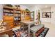 Charming dining area with a large wooden bookcase, table, and bench seating, ideal for gatherings at 4560 E Cactus Canyon Dr, Pahrump, NV 89061