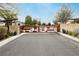 Gated entrance with decorative metal work and stone pillars at 4560 E Cactus Canyon Dr, Pahrump, NV 89061