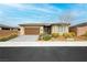 Charming single-story home with a two-car garage and well-maintained landscaping at 4560 E Cactus Canyon Dr, Pahrump, NV 89061