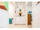 Hallway featuring a decorative cabinet and a glimpse into an adjacent room, creating visual interest at 4560 E Cactus Canyon Dr, Pahrump, NV 89061