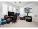 Bright home office with three windows featuring plantation shutters and a decorative art piece at 4560 E Cactus Canyon Dr, Pahrump, NV 89061