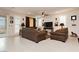 Inviting living room with cozy seating and a ceiling fan, offering a comfortable and stylish space at 4560 E Cactus Canyon Dr, Pahrump, NV 89061