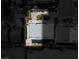 An aerial view of a modern building featuring a flat roof and an adjacent parking area at 5014 Thunder River Cir, Las Vegas, NV 89148