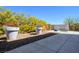Backyard with two large planters and a low-maintenance gravel area at 5014 Thunder River Cir, Las Vegas, NV 89148