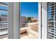 Balcony view showing the exterior of the home and the surrounding neighborhood under a clear blue sky at 5014 Thunder River Cir, Las Vegas, NV 89148