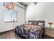 Comfortable bedroom with contemporary decor, plush bedding, and ample natural light from the window at 5014 Thunder River Cir, Las Vegas, NV 89148