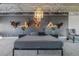 Stylish bedroom with unique decor, elegant chandelier, and comfortable bedding, creating a luxurious retreat at 5014 Thunder River Cir, Las Vegas, NV 89148