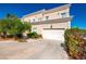 Stunning two-story home with a well-maintained yard and attached two-car garage at 5014 Thunder River Cir, Las Vegas, NV 89148