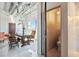 Stylish hallway with glass railing leading to an open office area featuring a large window and a modern desk at 5014 Thunder River Cir, Las Vegas, NV 89148
