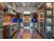 Open kitchen design featuring stainless steel Viking appliances, custom cabinetry, and ample counter space at 5014 Thunder River Cir, Las Vegas, NV 89148