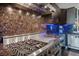 Modern kitchen boasts stainless steel Viking range, custom backsplash, and sleek dark cabinetry at 5014 Thunder River Cir, Las Vegas, NV 89148