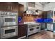 Gourmet kitchen featuring stainless steel Viking appliances, double ovens, and custom cabinetry at 5014 Thunder River Cir, Las Vegas, NV 89148