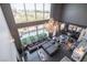 An aerial view of a living room with floor-to-ceiling windows that offer beautiful city views at 5014 Thunder River Cir, Las Vegas, NV 89148