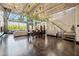 Open-concept living and dining area featuring soaring ceilings, chandeliers and abundant natural light at 5014 Thunder River Cir, Las Vegas, NV 89148