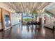 Modern living room with high ceilings, chandeliers, dining area, staircase and expansive windows offering plenty of natural light at 5014 Thunder River Cir, Las Vegas, NV 89148
