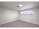 Bright bedroom featuring natural light, neutral carpet, and white walls at 5204 Doe Ave, Las Vegas, NV 89146