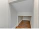 A small, unfinished closet with wood flooring at 5465 Cardinal Ridge Ct # 103, Las Vegas, NV 89149