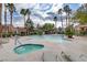 Relaxing community pool area with lounge chairs and lush landscaping; ideal for leisure and social gatherings at 5465 Cardinal Ridge Ct # 103, Las Vegas, NV 89149
