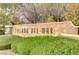 Entrance to Solana Del Mar community featuring a decorative tile sign surrounded by manicured greenery at 5465 Cardinal Ridge Ct # 103, Las Vegas, NV 89149