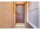 Elegant front door with a decorative wreath and sidelight at 5465 Cardinal Ridge Ct # 103, Las Vegas, NV 89149