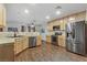 Well-lit kitchen features stainless steel appliances and light wood cabinets at 5465 Cardinal Ridge Ct # 103, Las Vegas, NV 89149