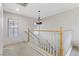 Bright landing features carpeted floors and a decorative hanging chandelier at 5465 Cardinal Ridge Ct # 103, Las Vegas, NV 89149