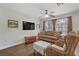 Comfortable living room with a sofa, accent chair, and hardwood floors at 5465 Cardinal Ridge Ct # 103, Las Vegas, NV 89149