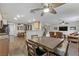 Open-concept living space with modern decor and a seamless flow between living, dining, and kitchen areas at 5465 Cardinal Ridge Ct # 103, Las Vegas, NV 89149