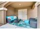 Comfortable patio with plush blue seating, perfect for relaxing outdoors at 5465 Cardinal Ridge Ct # 103, Las Vegas, NV 89149