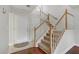 Elegant staircase with carpeted steps and a white railing at 5465 Cardinal Ridge Ct # 103, Las Vegas, NV 89149