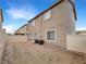 Backyard view featuring block wall, a gate, and low maintenance gravel landscaping at 6228 Grace Mountain St, Las Vegas, NV 89115
