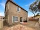 Private backyard featuring a paved stone patio, minimal vegetation, and block wall perimeter at 6228 Grace Mountain St, Las Vegas, NV 89115