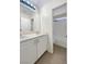 Clean bathroom with double sinks, modern lighting, and a shower-tub combo at 6228 Grace Mountain St, Las Vegas, NV 89115