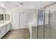 Bathroom with double vanity, glass shower, and neutral tile at 6228 Grace Mountain St, Las Vegas, NV 89115