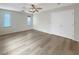 Bright bedroom features hardwood floors, ceiling fan, and natural light at 6228 Grace Mountain St, Las Vegas, NV 89115