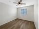 Bedroom with hardwood floors, ceiling fan, and window at 6228 Grace Mountain St, Las Vegas, NV 89115