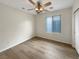 Cozy bedroom with hardwood floors and a ceiling fan at 6228 Grace Mountain St, Las Vegas, NV 89115