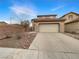 Charming home featuring a two-car garage, low-maintenance landscaping, and a cozy, inviting facade at 6228 Grace Mountain St, Las Vegas, NV 89115